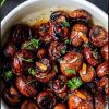 alt="Garlic Butter Air Fryer Mushrooms served warm with parsley and garlic butter"