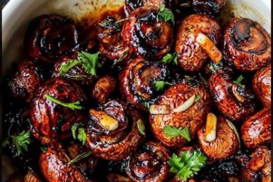alt="Garlic Butter Air Fryer Mushrooms served warm with parsley and garlic butter"